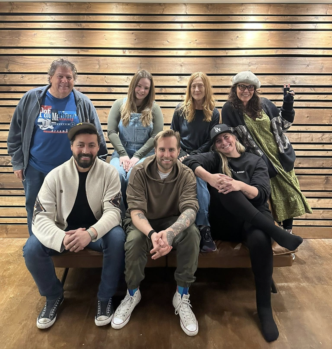 Mike with intensive attendees posed on a bench